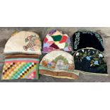 Collection of five vintage tea cosies including two blank ground examples with embroidered