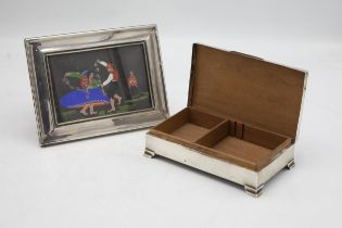 Engine turned silver cigarette box, cedar lined interior, with a further silver easel frame (2)