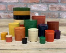 Set of fourteen early hand carved Scandinavian graduating cylinder containers, lacquered finish to