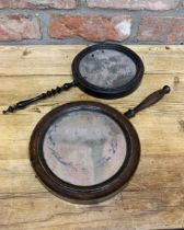 Two similar Georgian hand mirrors, with turned handles and original pitted glass, both 34.5cm