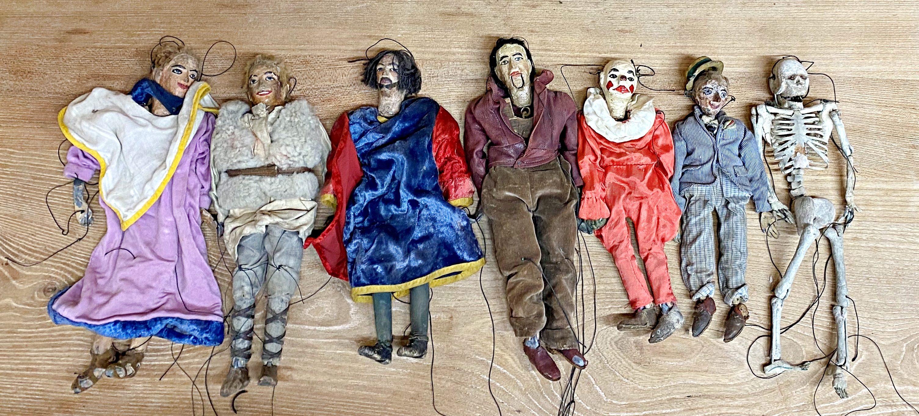 Collection of seven 19th century Folk Art puppets, with lead feet (the skeleton with lead head),