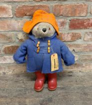 Vintage Padddington Bear teddy with original red Dunlop wellies and travel tag, H 55cm