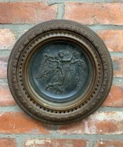 Antique ceramic plate depicting winged maiden and cherub held in pierced copper frame, stamped 'J.M'