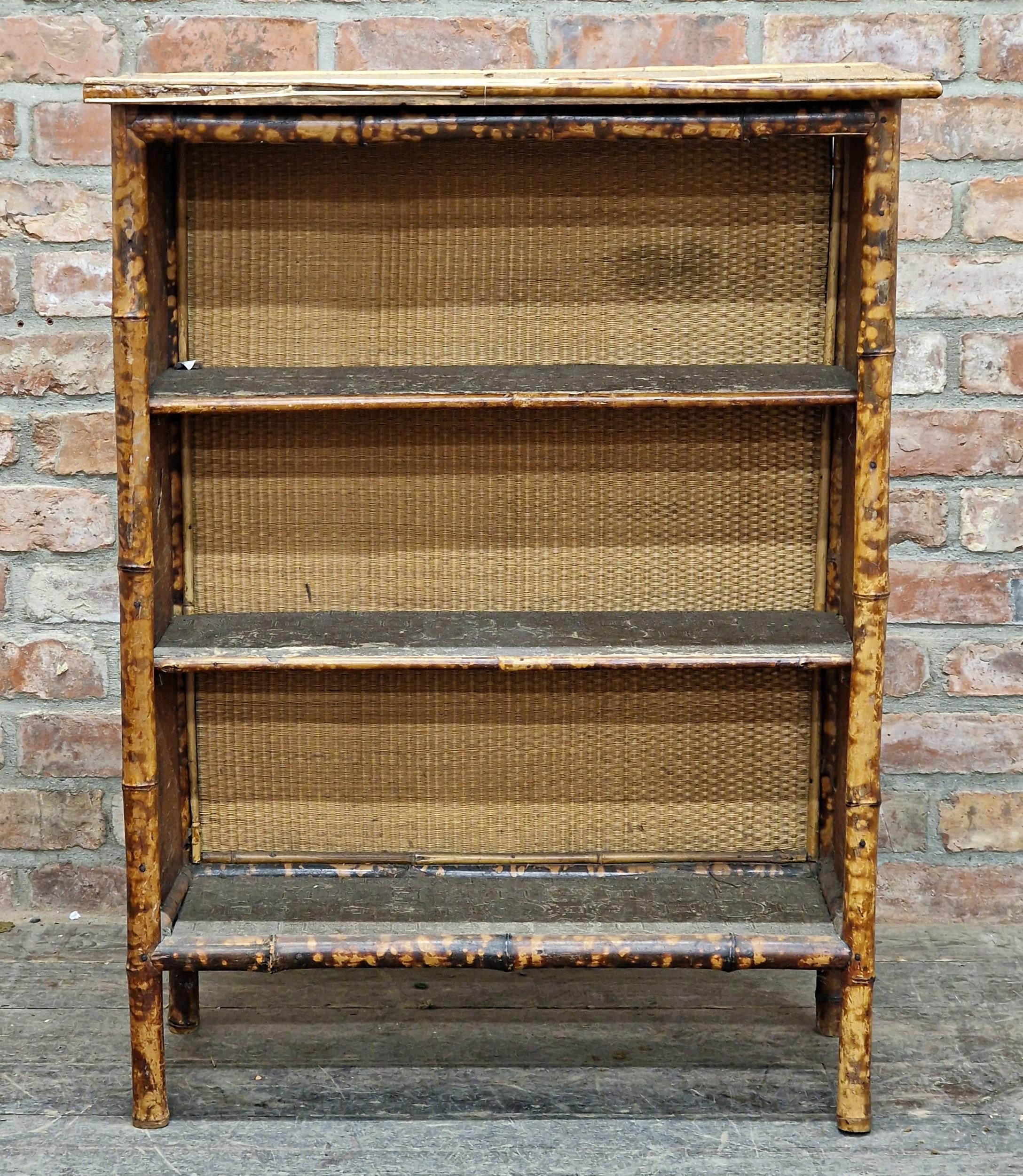 Victorian Aesthetic Movement bamboo and rattan open bookcase, the three fitted shelves with embossed