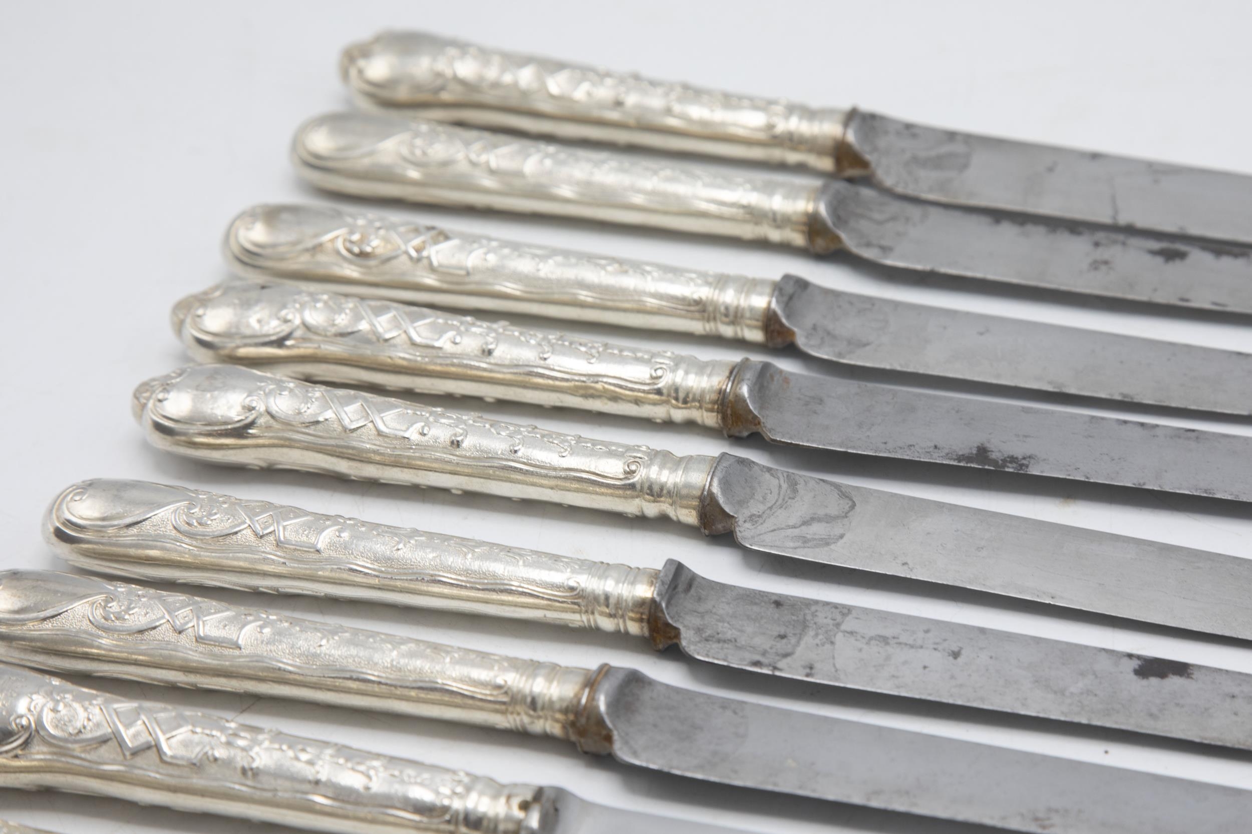 Good quality set of eight silver cannon handled table and dessert knives, the handle embossed with - Image 2 of 2