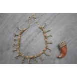 Victorian silver gilt and coral fringe necklace, 38cm long with a carved coral claw brooch (2)