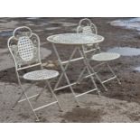 A painted metal three piece folding garden terrace set to include a table and two chairs with