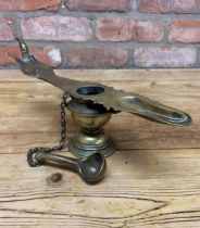 Large antique Indian brass Changalavatta oil lamp with attached oil spoon, H 15cm x L 36cm