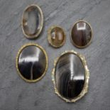 Five large 19th century banded agate brooches, the largest 5.5 x 7.7cm (5)