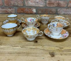 Assortment of antique hand painted peach floral themed cups, saucers and plates