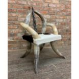 Stylish designer cow horn and hide chair, 100cm high