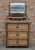 Victorian Aesthetic Movement bamboo and rattan dressing chest with mirror back raised over one short