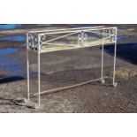 A painted wrought iron plant stand with scroll work detail, H 71cm x W 106cm x D 21cm