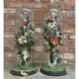 Good pair of Victorian woven silk floral dioramas in bisque vases, under good tall circular glass