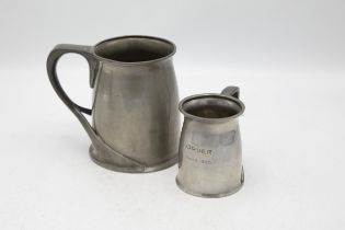 Archibald Knox for Liberty & Co of London - two Tudric pewter tankards model 066, 13cm and 9cm