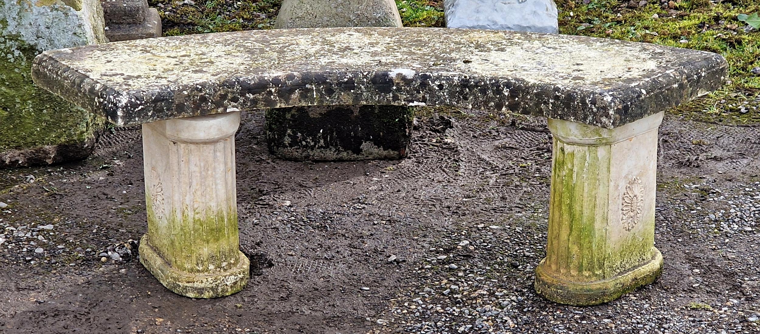 A reconstituted stone three piece garden bench with curved top raised on fluted pedestal supports, H - Image 2 of 2