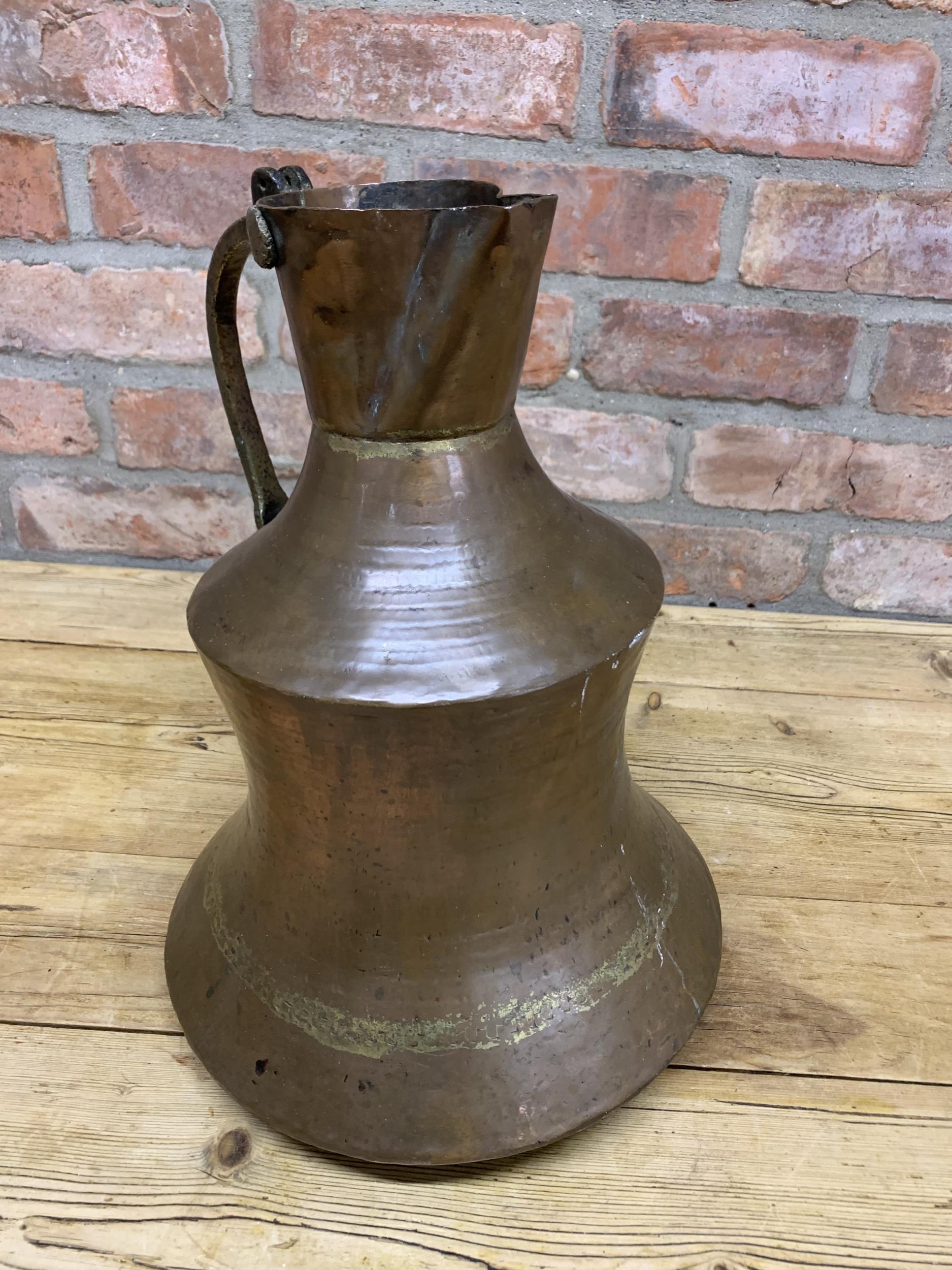Large early Persian copper ewer with cast brass handle, 39cm high - Image 4 of 4