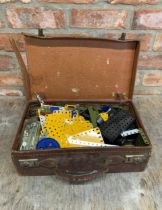 Vintage suitcase filled with Meccano with three instruction manuals for building a crane