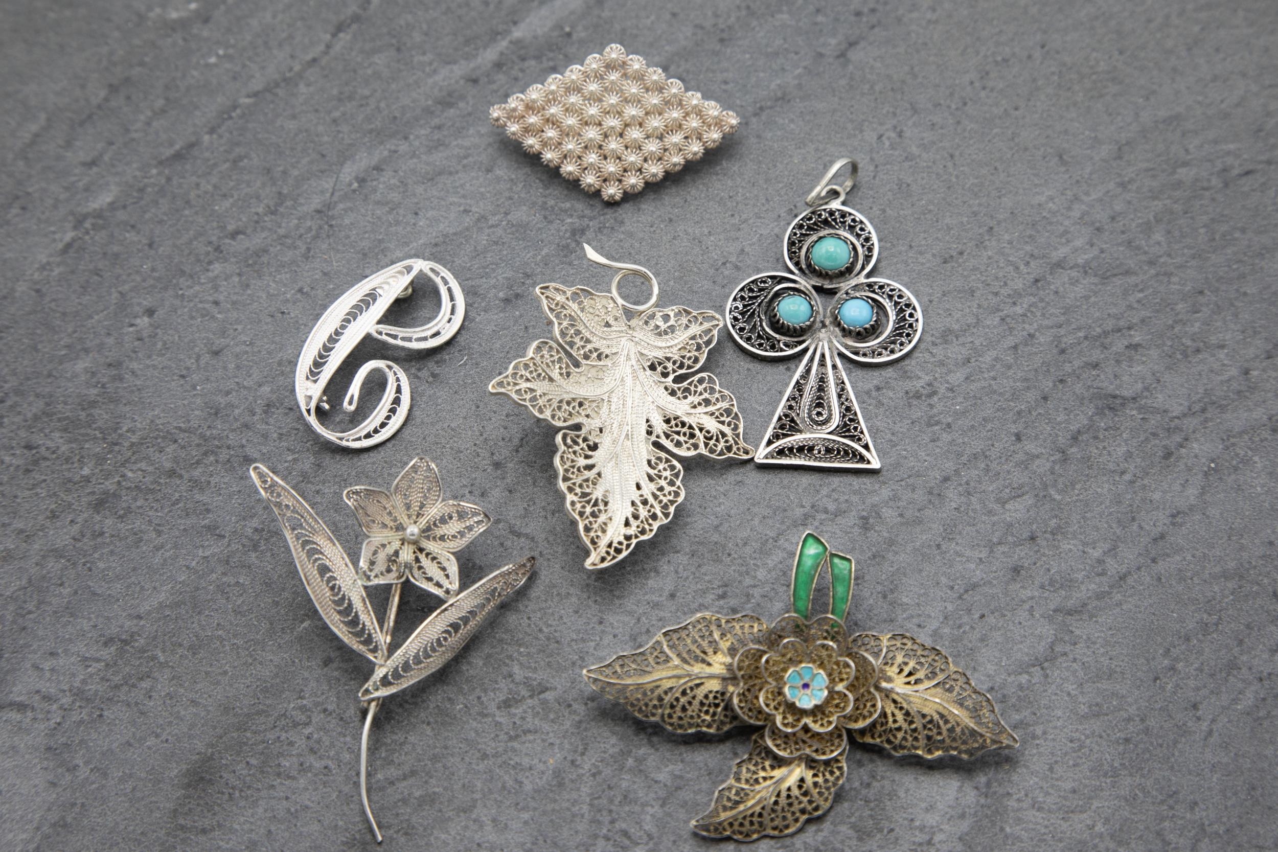 Six filigree silver brooches or pendants to include turquoise inset club pendant and enamelled - Image 2 of 2