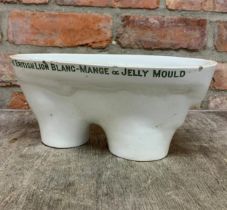 The British Lion blanc mange white ceramic jelly mould, 28cm x 13cm