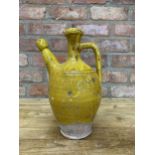 Antique 18th century primitive French clay pitcher with mustard yellow glaze, H 29cm