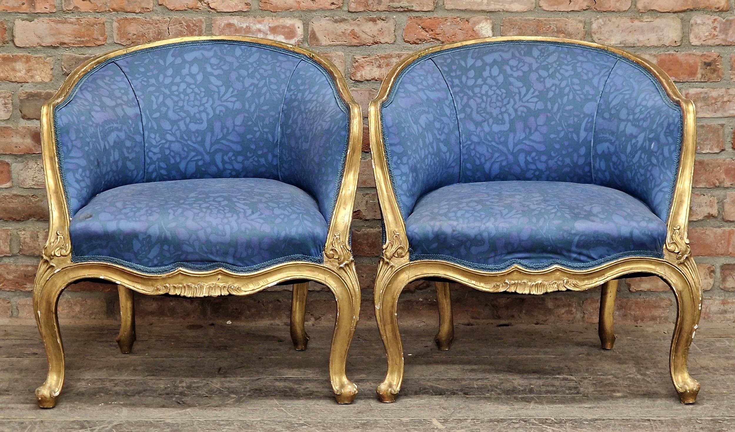 Pair of good quality 19th century French gilt wood tub chairs with blue floral fabric upholstery,