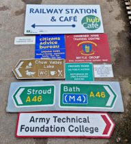 A collection of various different signs to include road signs, citizens advice, combined arms