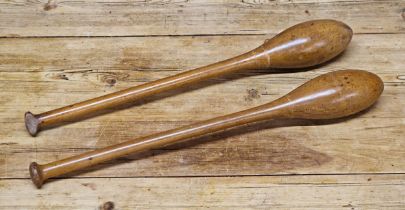 Pair of vintage wooden exercise juggling clubs, L 55cm