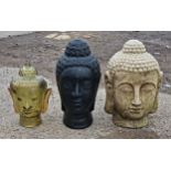 Contemporary reconstituted stone ornament of a Buddha head, H 41cm x W 27cm together with two