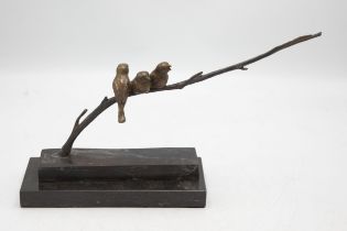 Stylised bronze character group of three birds on a branch upon a marble base, H 19cm x W 32cm