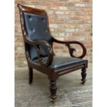 Regency flame mahogany framed library chair, studded leather upholstery and ceramic casters