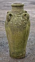 Weathered terracotta amphora with four loop handles and incised detail, H 77cm