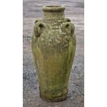 Weathered terracotta amphora with four loop handles and incised detail, H 77cm