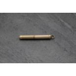 9ct engine turned propelling toothpick, 5cm long, 7.2g