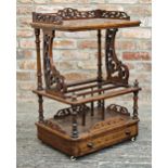 Victorian walnut Canterbury whatnot with fret carved lyre sides and drawer to base, raised on