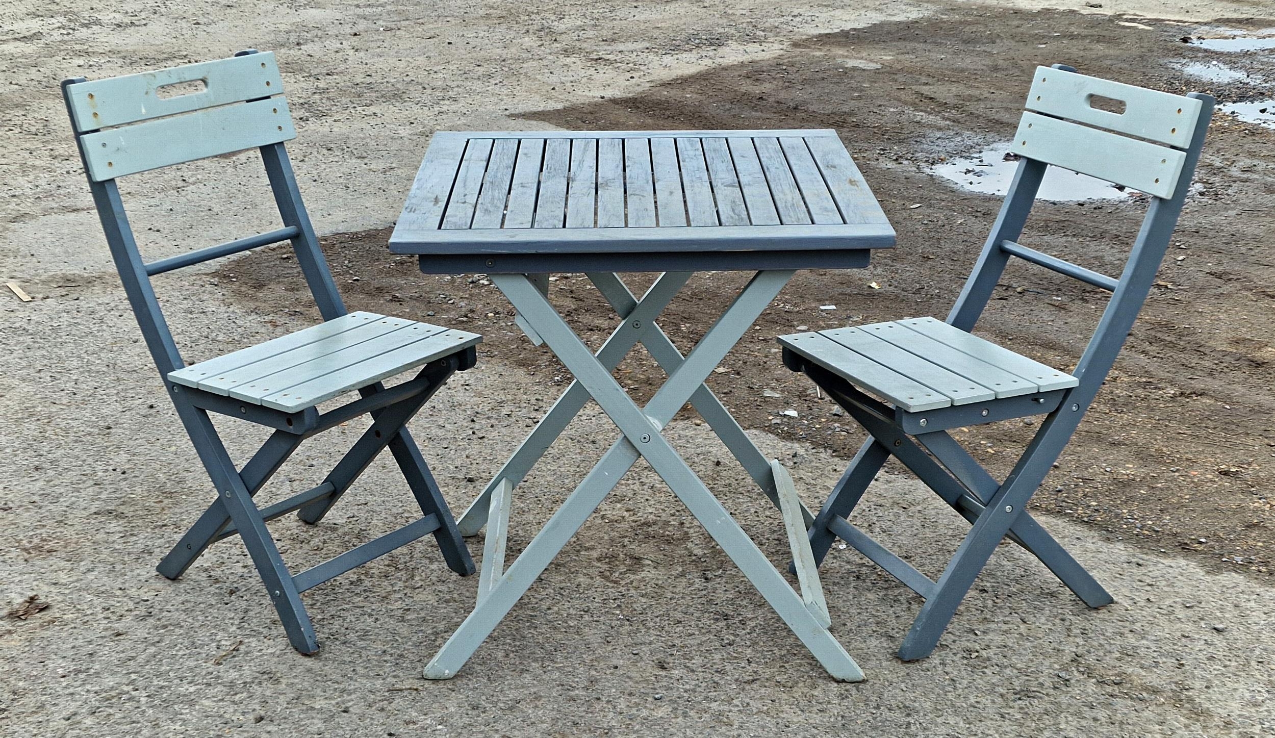 Contemporary painted wooden fold out garden table and two chairs, H 74cm x W 70cm x D 70cm (