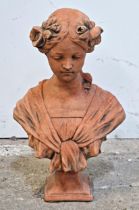 A terracotta bust of a lady in floral headdress, H 43cm