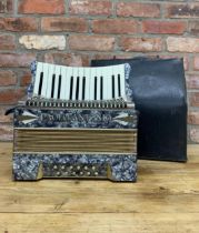 Paolo Antonio twenty four key accordion instrument with faux marble finish, held within original