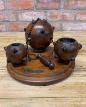 Hand carved mahogany sea mine desk tidy to include match strike, inkwell, lidded storage and