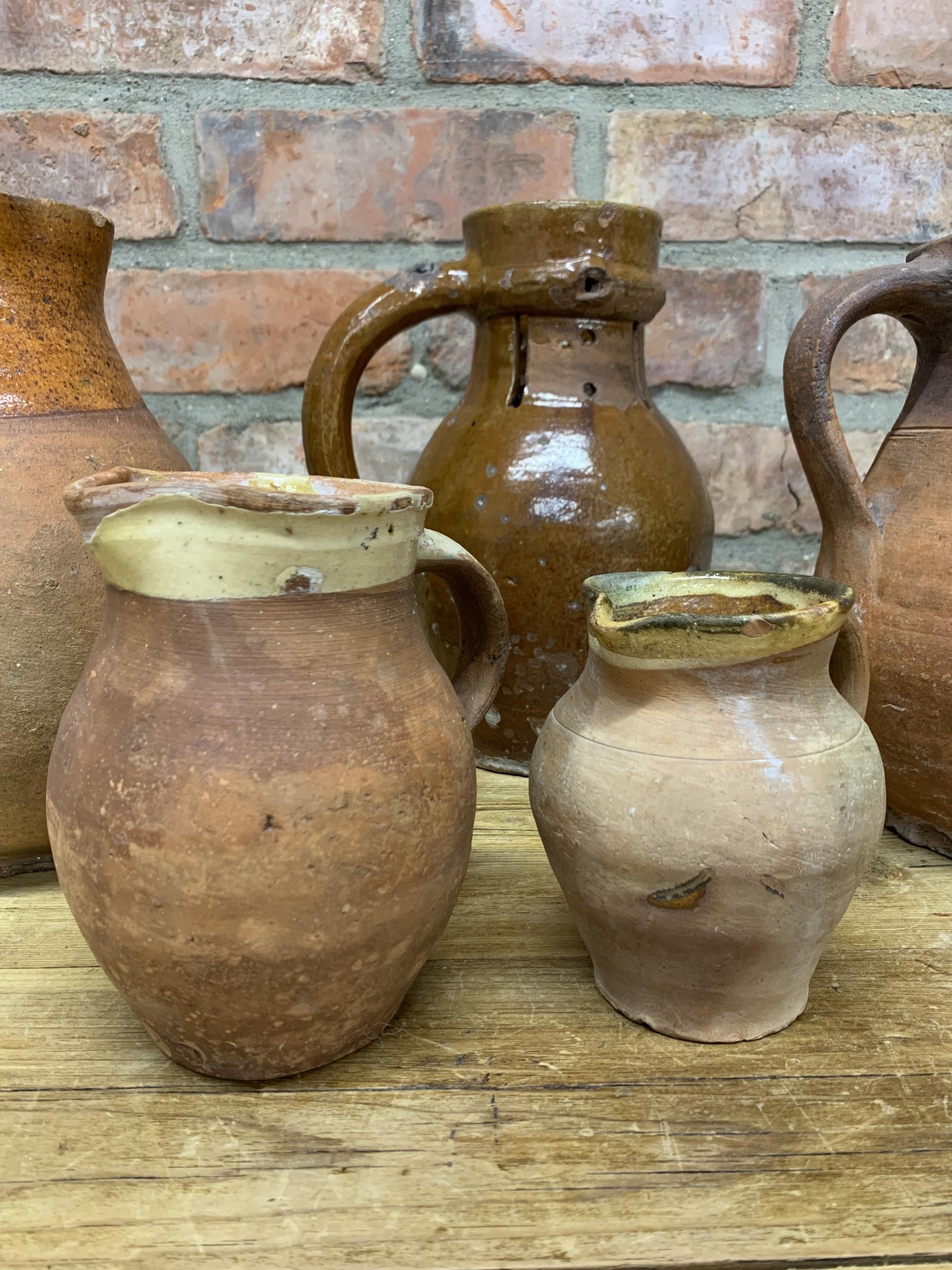 Four antique 18th Somerset glazed earthenware pitcher jugs with additional glazed puzzle jug - Image 3 of 5