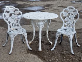 A good quality heavy garden terrace set to include two rose pattern chairs, H 82cm, and a