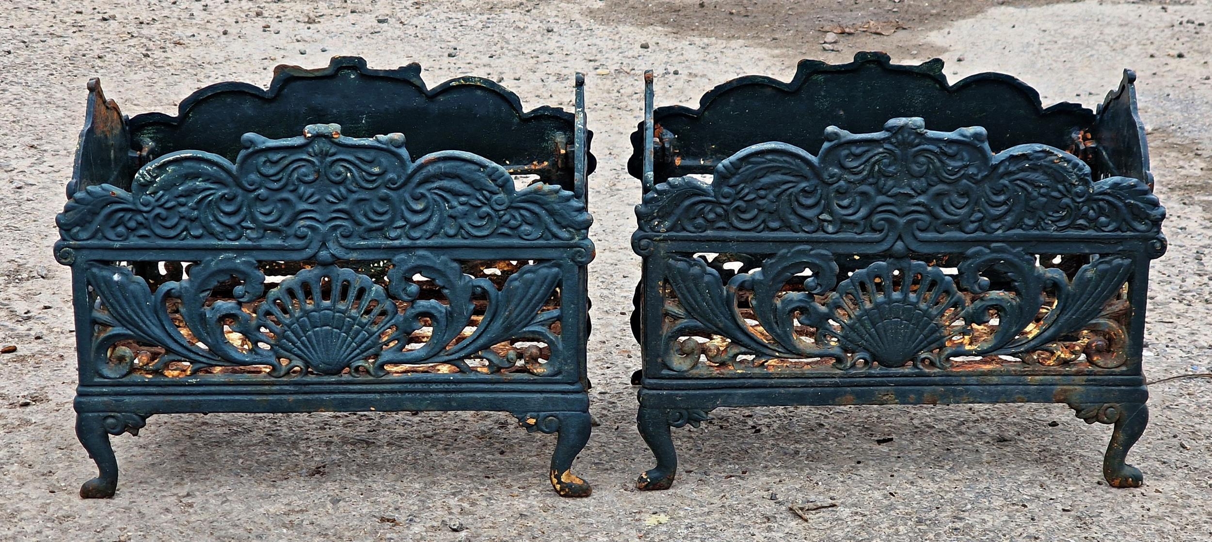 Pair of painted Victorian style cast iron plant stands with pierced scrolling detail, H 28cm x W
