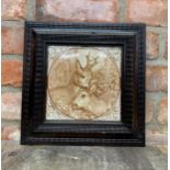 Large Victorian Aesthetic period ceramic tile of deers in carved wooden frame, H 31cm x W 31cm