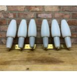 Two sets of brass Mid-Century three branch wall lights having period milk glass shades, H 40cm x W