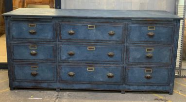 Substantial antique painted industrial sideboard or bank of drawers, fitted with nine deed fielded