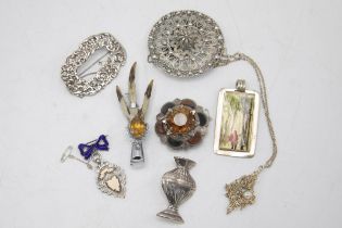 Mixed collection of Scottish silver and similar brooches and pendants (8)