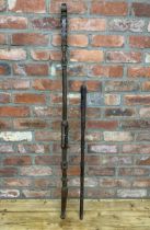 Two hand carved West African ceremonial tribal sticks, largest L 130cm