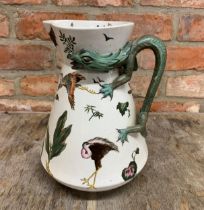 Hand painted antique ceramic jug with bird design and dragon styled handle, H 30cm