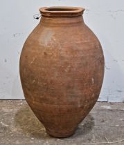 A weathered terracotta amphora, H 63cm