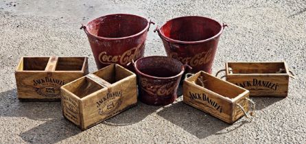 Three vintage galvanised buckets with Coca Cola painted decals together with four wooden trugs